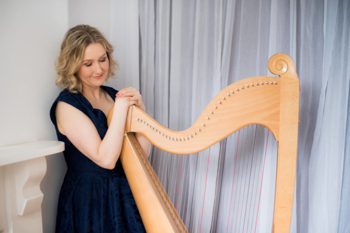 Bethan Nia posing with her harp